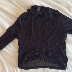 Going out top. Some wear in the armpit area. Medium but can fit a small